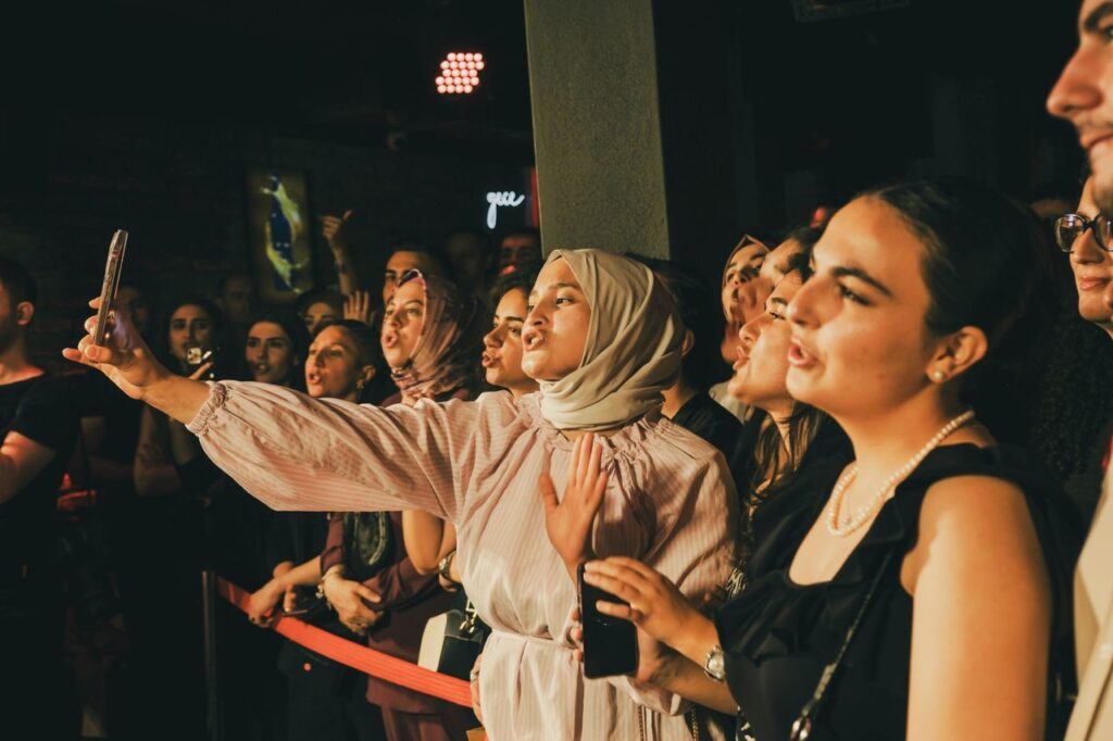 A vibrant group of young adults enjoying a night out at a lively event in Ankara.